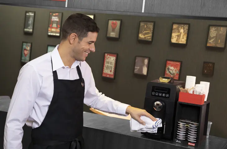 A consumer using the bar towel