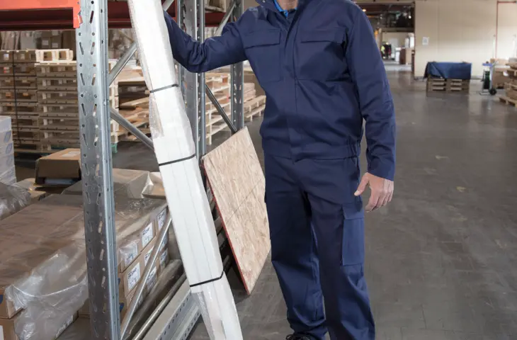 A man wearing a Graph'IT coverall